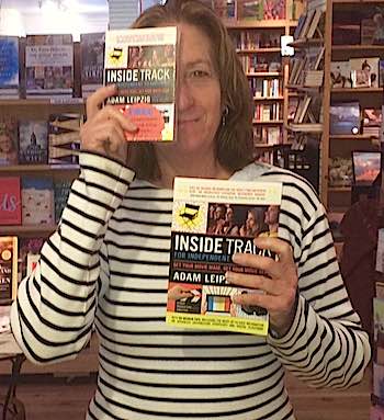 Sue Fassett, manager of Dolly's Bookstore in Park City, with 'Inside Track'