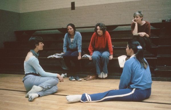 Sarah (far left) with Sarah (far left) and inmates (Krenny in red sweatshirt) in discussion.