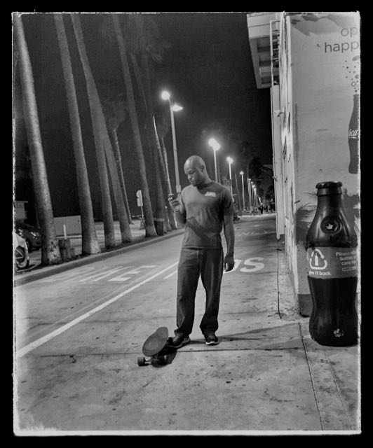 lone man boardwalk Venice