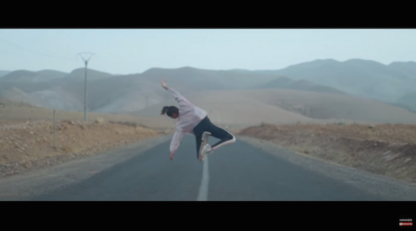 Hajiba Fahmi dances mid-air over a desert highway 