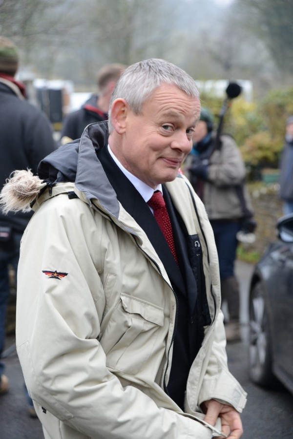 Martin Clunes takes a break in filming for DOC MARTIN, in which he plays the grumpy town surgeon who suffers from an odd distaste for the sight of blood!  From APT Syndication.