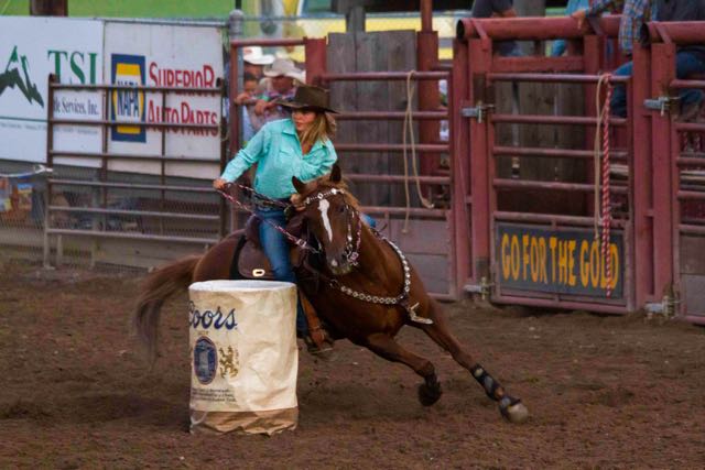 Just beautiful cowgirl demonstrating full on control in the Barrel Racing Competition, Helmville Rodeo, 2015