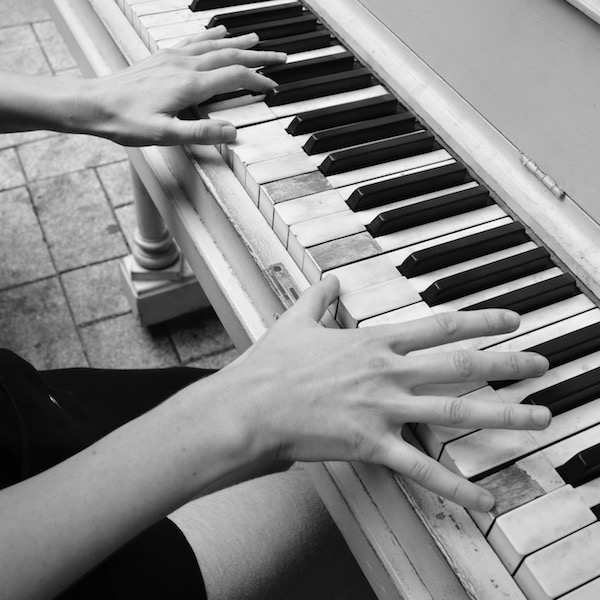 public piano player's hands