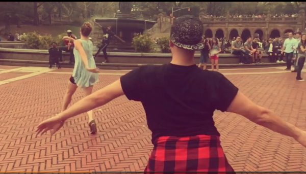 Two dancers pull the camera with them at Bethesda Fountain