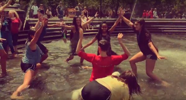 Nicole Walcott engages girls in fountain to dance with her