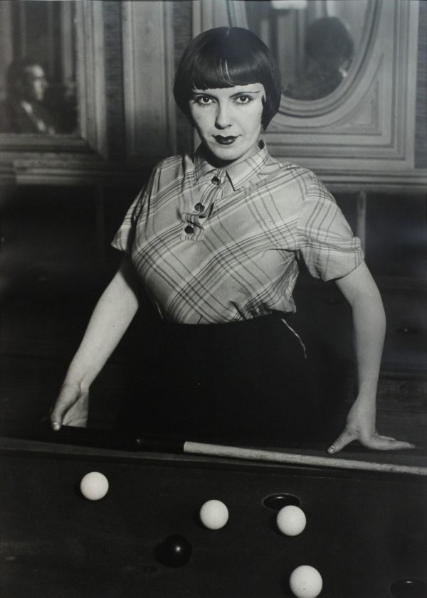 A prostitute playing billiards, Montmartre © 1932 Brassai
