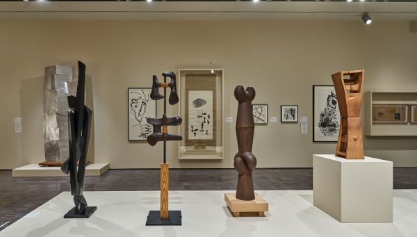 Installation view of "Changing and Unchanging Things: Noguchi and Hasegawa in Postwar Japan," with Noguchi sculptures in foreground, Hasegawa painting and drawings on the wall; 2019 photo (c) Asian Art Museum.